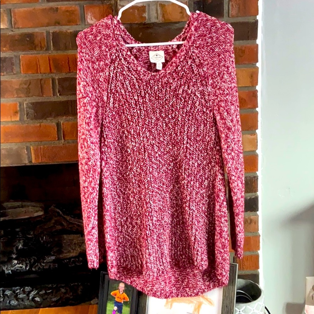 Long knit sweater, longer in the back.